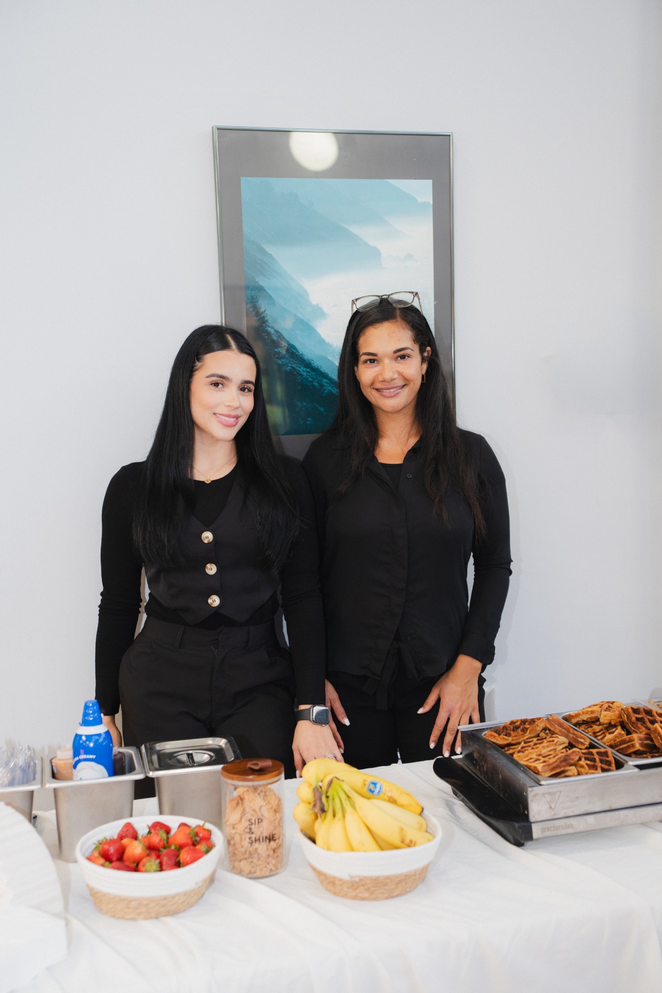 Sip and Shine Wellness Bar hosts at the protein-waffle station
