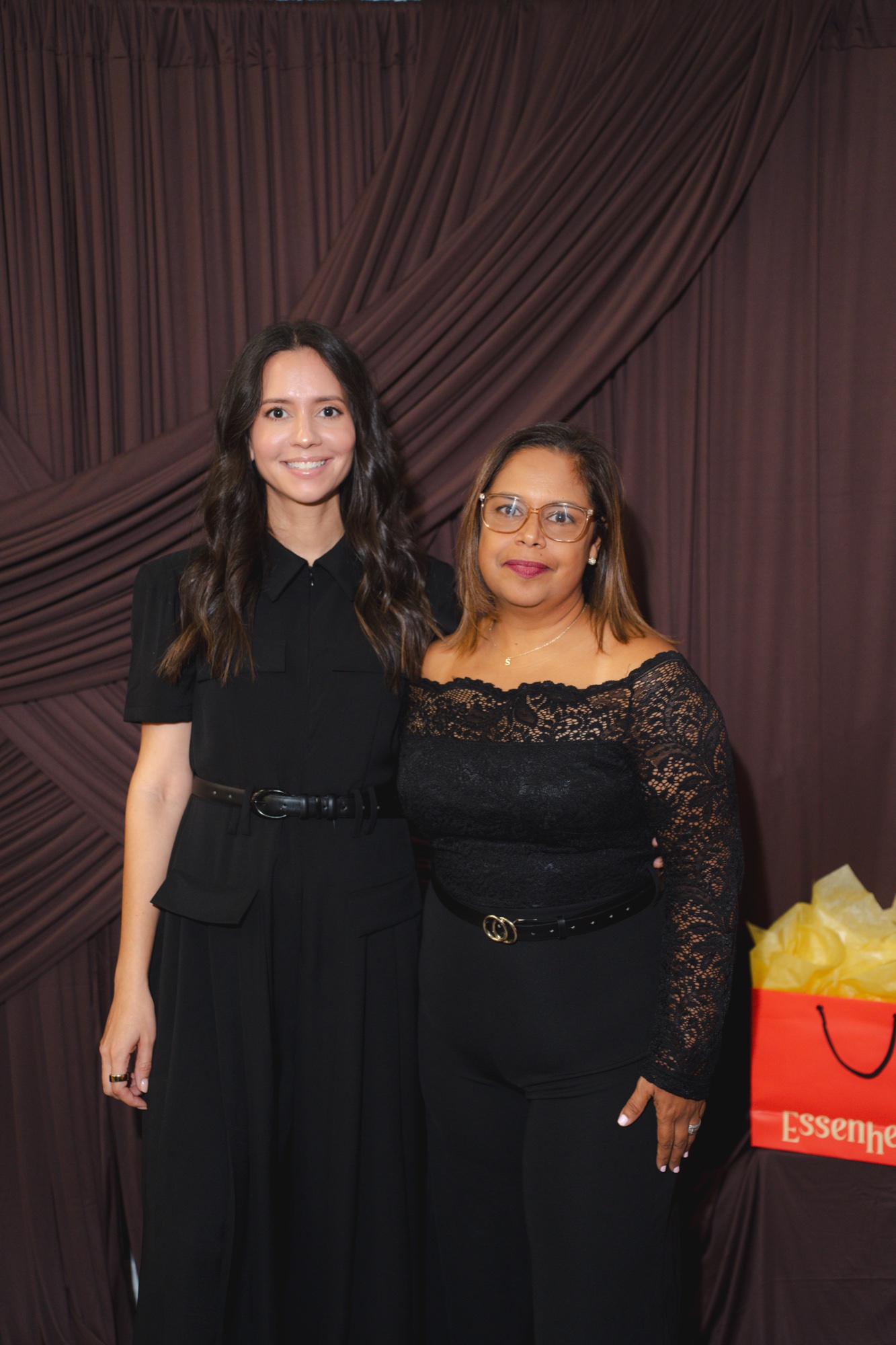 Two guests posing at the photobooth